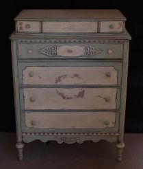 Moss green and peach country-style cabinet-top dresser; 1920s.